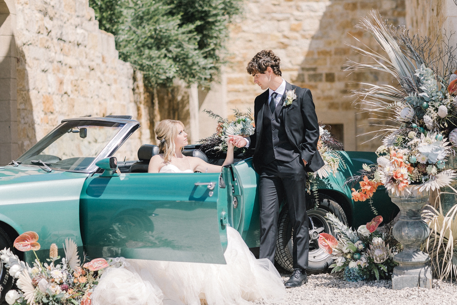 Bride and Groom with vintage car