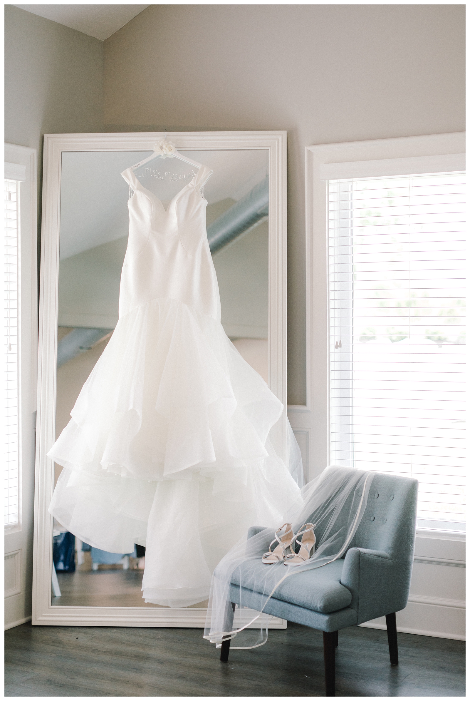 Wedding gown hanging on mirror